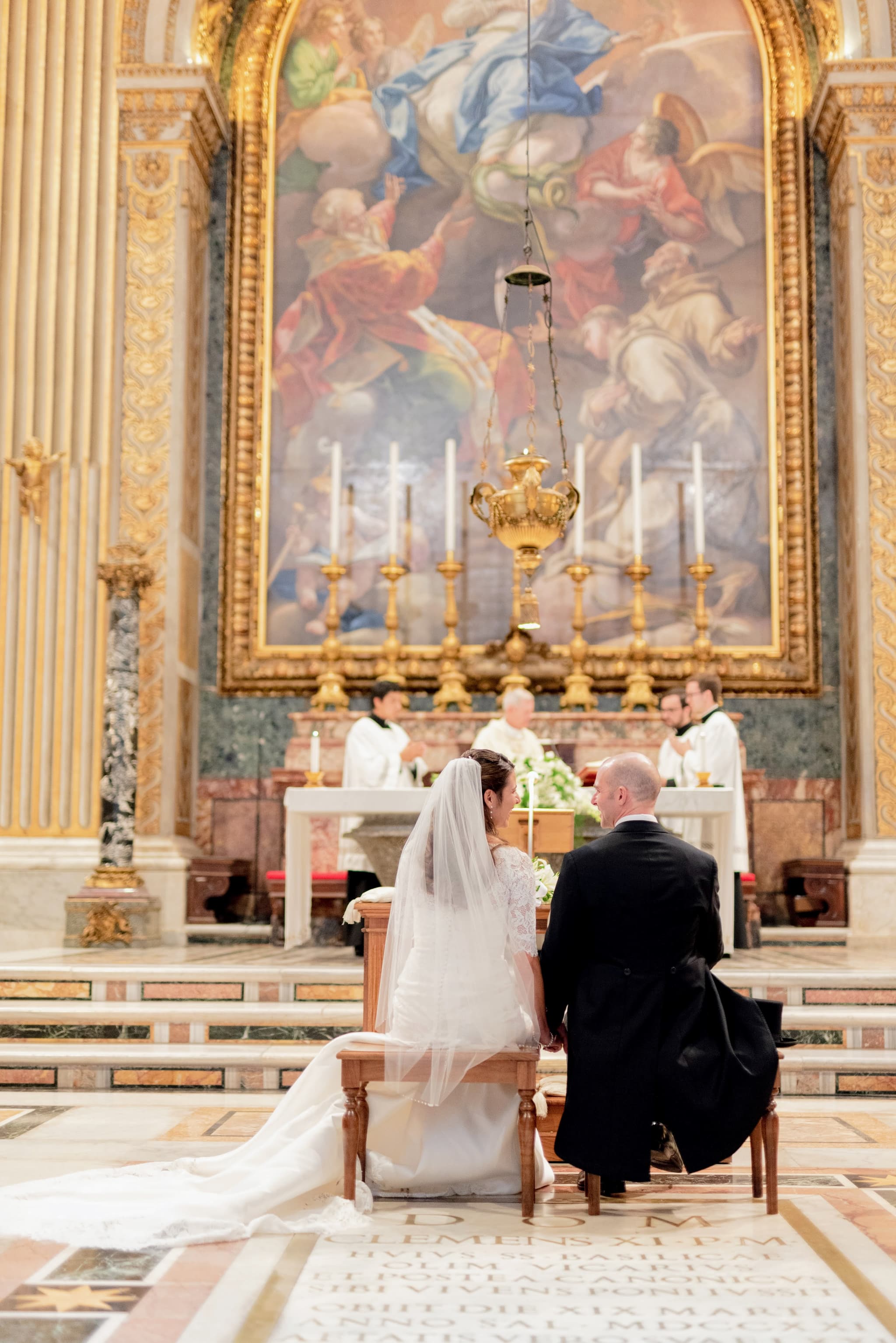 Couple at the altar during a Catholic wedding ceremony